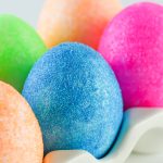 Glitter Easter eggs in a ceramic egg holder